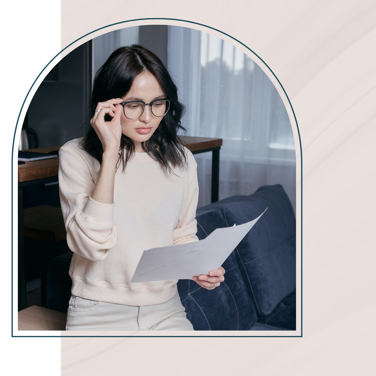 Image of woman looking at her finances.